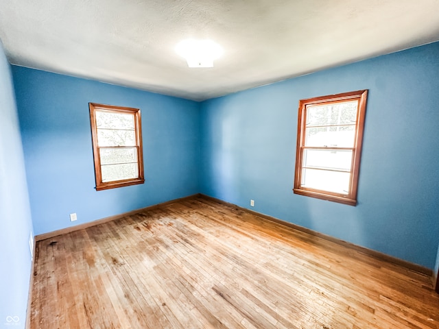 unfurnished room featuring light hardwood / wood-style floors