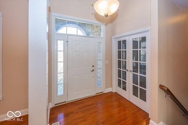 entrance foyer featuring french doors and hardwood / wood-style floors