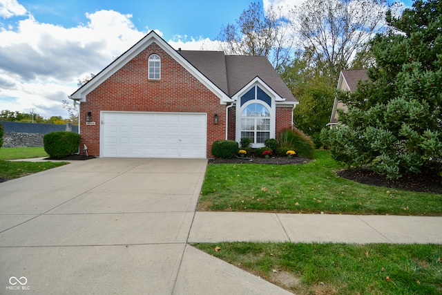 front of property featuring a front yard and a garage