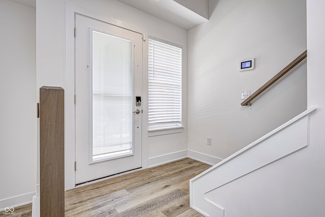 entryway featuring plenty of natural light and light hardwood / wood-style floors