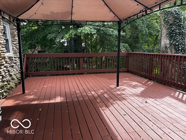 wooden deck with a gazebo