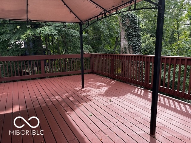 wooden deck featuring a gazebo