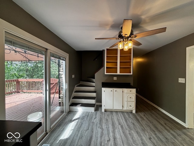 kitchen with white cabinets, ceiling fan, and wood-type flooring