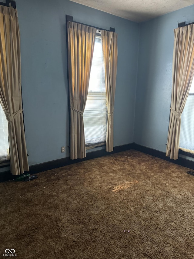 1804 N Delaware St, Indianapolis, IN 46202 - unfurnished room with dark carpet and baseboards