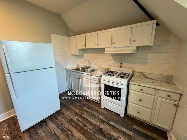 kitchen featuring lofted ceiling, white cabinetry, white appliances, and dark hardwood / wood-style flooring