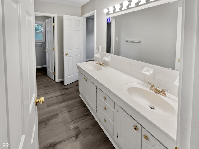 bathroom with wood-type flooring and vanity