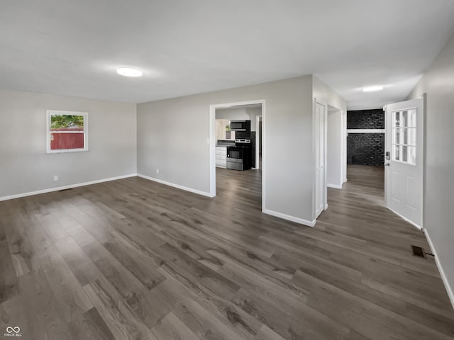 empty room with dark hardwood / wood-style floors