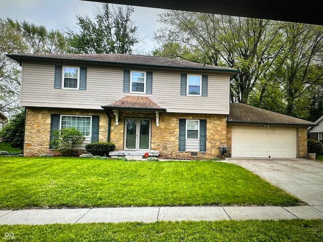 view of front facade with a front lawn and a garage