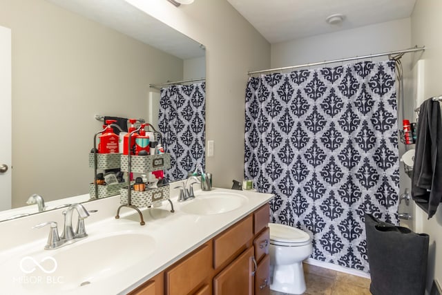 bathroom with vanity, toilet, curtained shower, and tile patterned floors