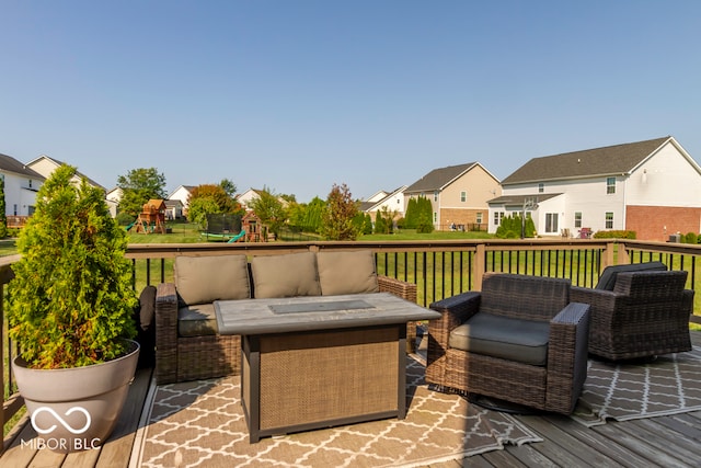 exterior space with a playground and a lawn