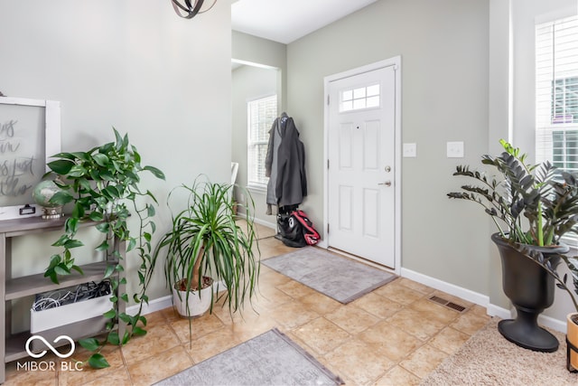 entrance foyer featuring light tile patterned flooring