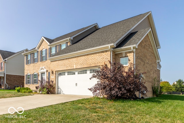 view of front facade featuring a front yard and a garage