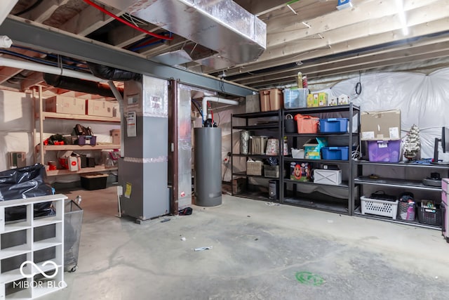 basement featuring heating unit and water heater