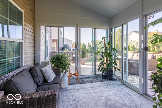 unfurnished sunroom featuring vaulted ceiling