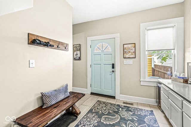 foyer with visible vents and baseboards