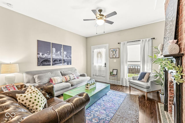 living area featuring a ceiling fan and wood finished floors