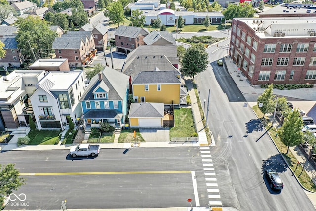 birds eye view of property with a residential view