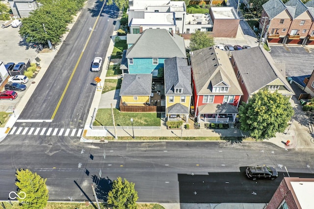 birds eye view of property with a residential view