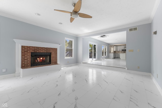 unfurnished living room featuring ceiling fan, ornamental molding, and a fireplace