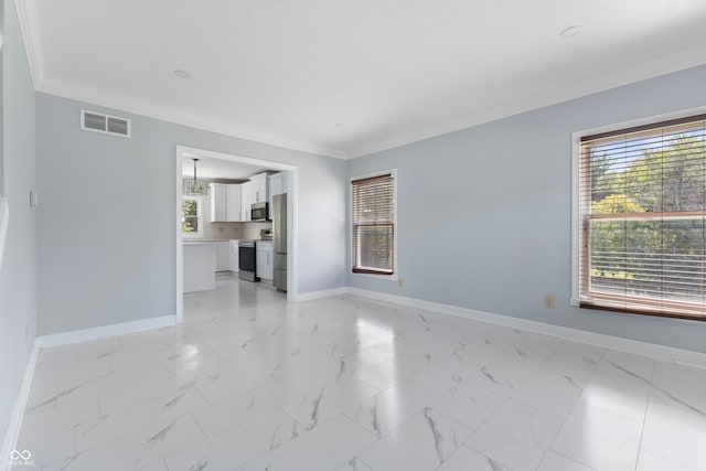 unfurnished living room with ornamental molding