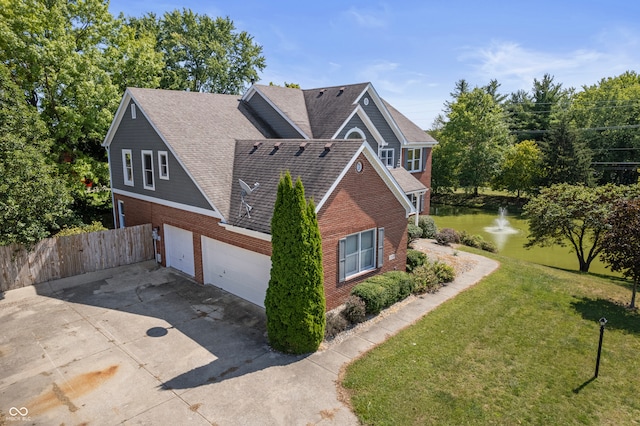 view of side of home featuring a yard and a garage