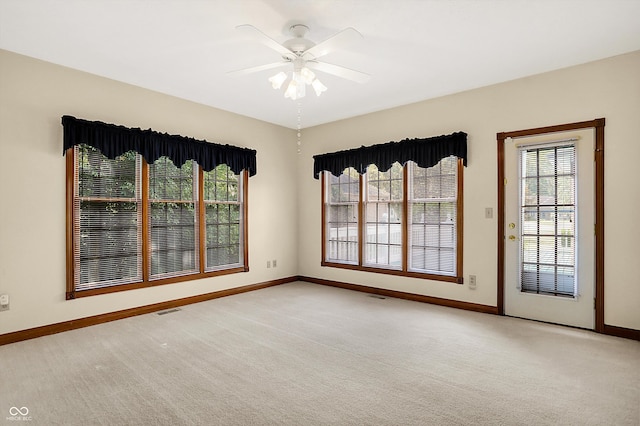 carpeted empty room with ceiling fan