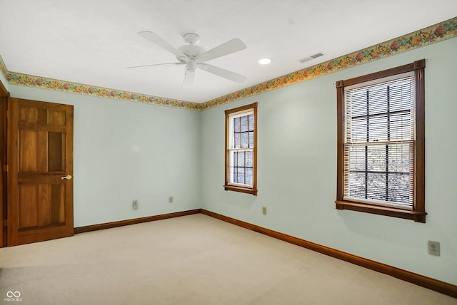 unfurnished room with carpet flooring and ceiling fan