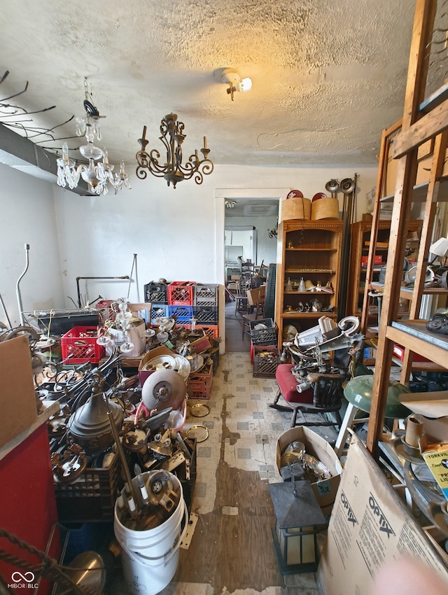 miscellaneous room featuring wood-type flooring and a textured ceiling