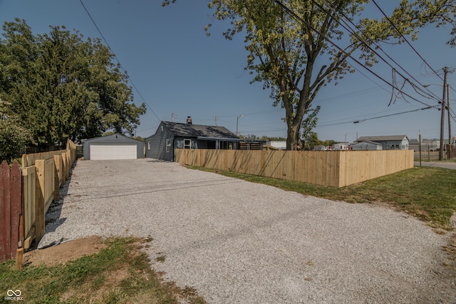 view of yard with an outbuilding and a garage