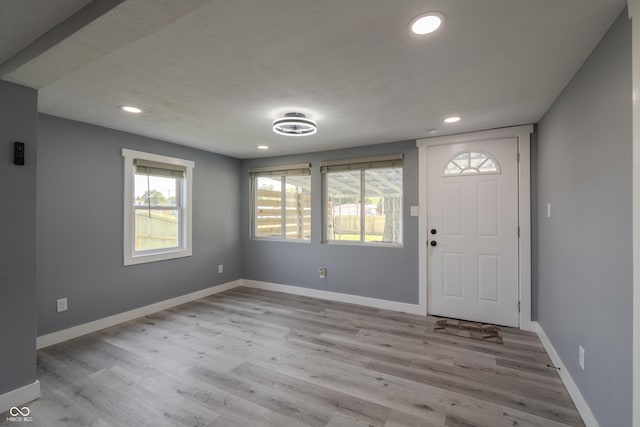 entryway with recessed lighting, baseboards, and wood finished floors