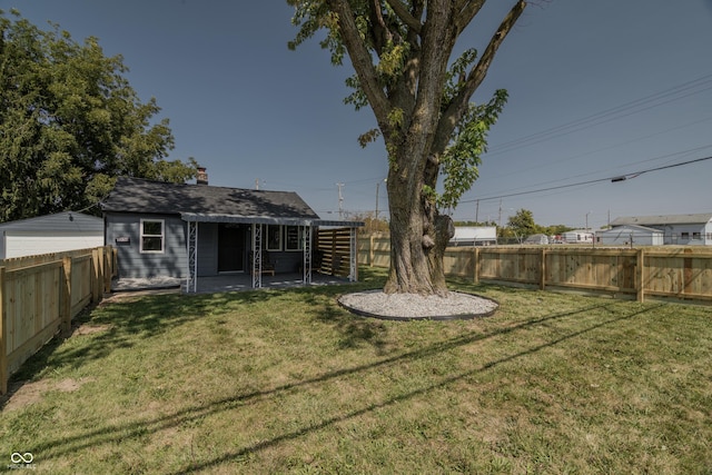 view of yard with a fenced backyard and a patio area