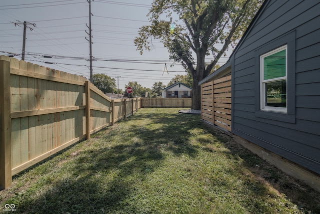 view of yard with a fenced backyard