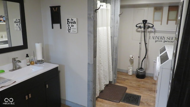 114 N Grant Ave, Crawfordsville, IN 47933 - bathroom with visible vents, wood finished floors, and vanity