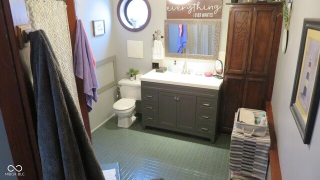 114 N Grant Ave, Crawfordsville, IN 47933 - bathroom with toilet, tile patterned flooring, and vanity