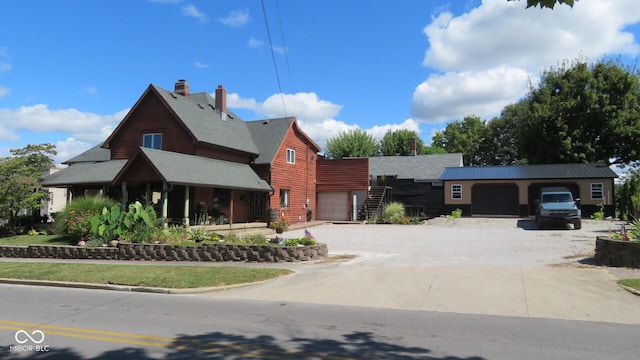 114 N Grant Ave, Crawfordsville, IN 47933 - view of front of house with driveway and a garage