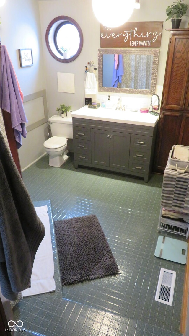 114 N Grant Ave, Crawfordsville, IN 47933 - bathroom featuring tile patterned floors, vanity, and toilet