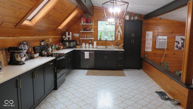 114 N Grant Ave, Crawfordsville, IN 47933 - kitchen with light countertops, wooden walls, a sink, black appliances, and lofted ceiling with skylight