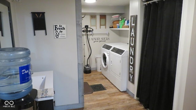 114 N Grant Ave, Crawfordsville, IN 47933 - laundry room with independent washer and dryer, laundry area, and light wood finished floors