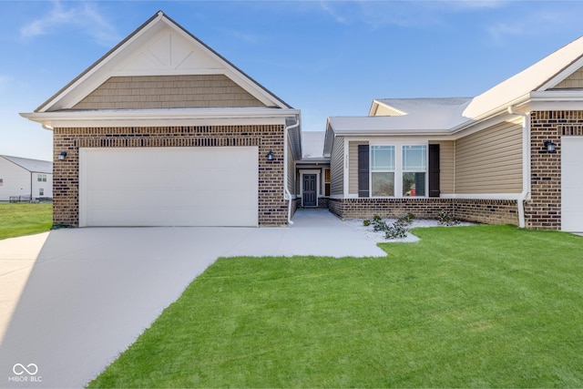 view of front of home with a front yard and a garage