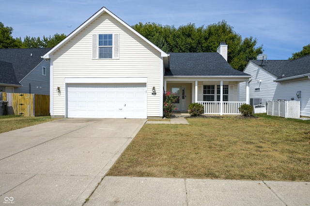 view of property featuring a porch, a garage, and a front yard