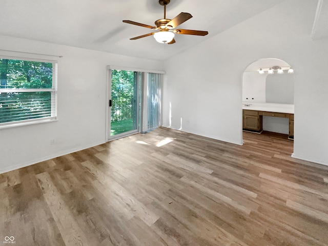 unfurnished living room with lofted ceiling, light hardwood / wood-style flooring, and ceiling fan