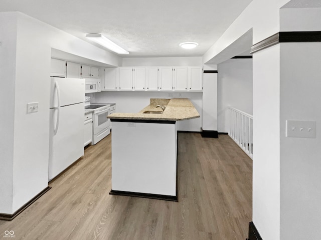 kitchen featuring light hardwood / wood-style flooring, white cabinets, white appliances, and sink