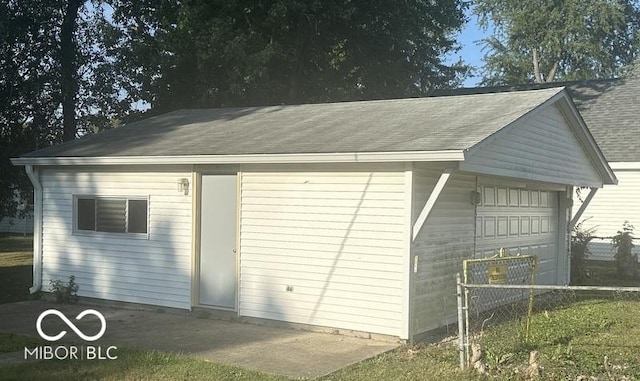 detached garage with fence