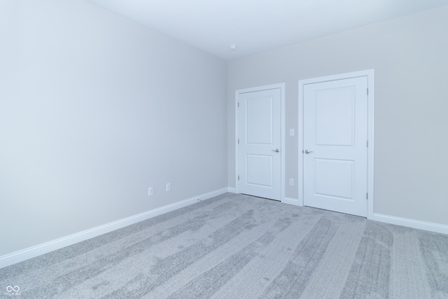 unfurnished bedroom with light carpet