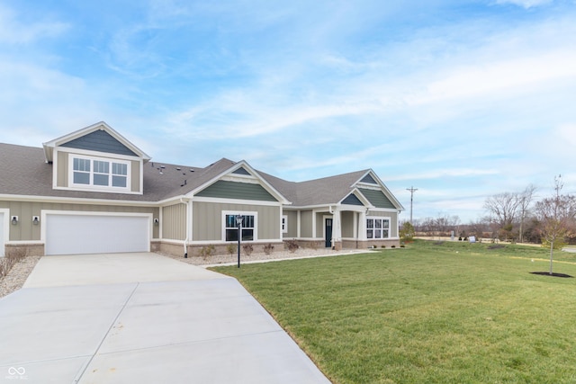 craftsman inspired home with a front yard and a garage