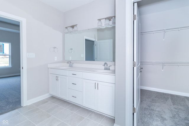 bathroom with tile patterned floors and vanity