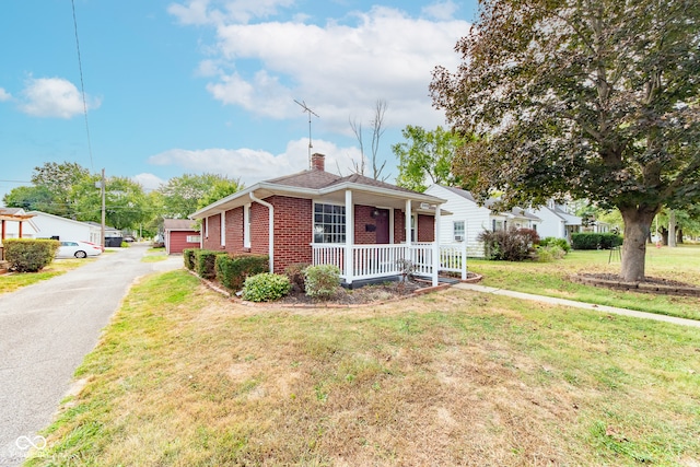 view of front of house with a front lawn and covered porch