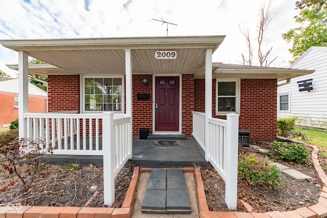 doorway to property with a porch