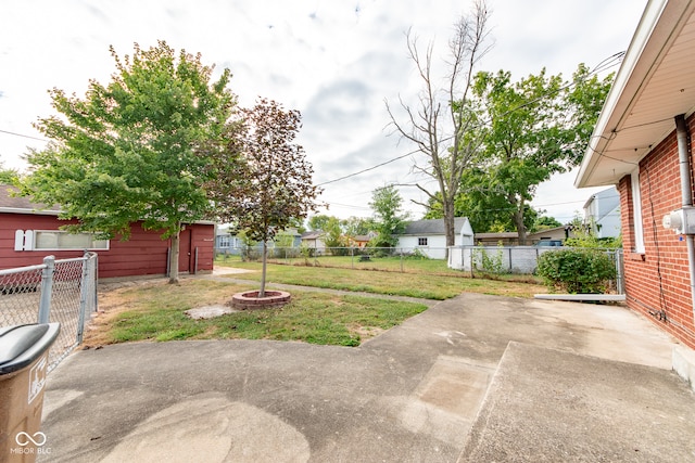 view of yard featuring a patio area and an outdoor fire pit