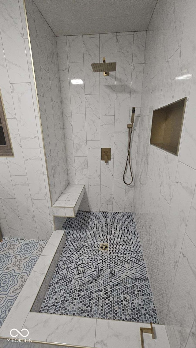 bathroom featuring a tile shower